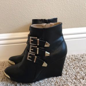 Black and gold booties